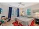 Welcoming bedroom featuring wood floors, stylish furnishings, and vibrant decor touches at 1960 Lincoln Dr, Sarasota, FL 34236