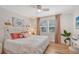 Cozy bedroom featuring hardwood floors, plush bedding, and decorative lighting fixtures at 1960 Lincoln Dr, Sarasota, FL 34236