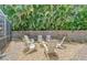 Backyard firepit area with seating offers a cozy spot for outdoor gatherings at 1960 Lincoln Dr, Sarasota, FL 34236