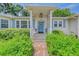 Close up shot of the front porch with stone walkway leading to the front door at 1960 Lincoln Dr, Sarasota, FL 34236