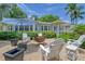 Charming home with inviting front yard seating area and lush landscaping at 1960 Lincoln Dr, Sarasota, FL 34236