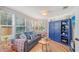 Comfortable living room with cozy furniture, natural light, and a decorative blue cabinet at 1960 Lincoln Dr, Sarasota, FL 34236