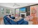 Cozy living room featuring a fireplace, comfortable seating, and a bright, airy feel at 1960 Lincoln Dr, Sarasota, FL 34236