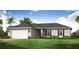 Charming single-story home featuring a manicured lawn, an attached two-car garage, and beautiful landscaping at 21061 Delake Ave, Port Charlotte, FL 33954