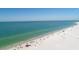 Breathtaking aerial shot of a vibrant beach with turquoise water, perfect for swimming and relaxation under the sun at 2267 Pueblo Ln # V40, Sarasota, FL 34231