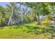 Backyard features lush greenery and trees at 2267 Pueblo Ln # V40, Sarasota, FL 34231