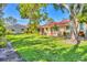 Backyard with a red tile roof home at 2267 Pueblo Ln # V40, Sarasota, FL 34231