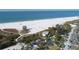 Aerial view of Siesta Key Beach showcasing the turquoise ocean, white sand, and lush greenery at 2267 Pueblo Ln # V40, Sarasota, FL 34231