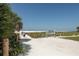 Entrance to Siesta Beach with a weathered wooden fence leading to pristine sands and clear skies at 2267 Pueblo Ln # V40, Sarasota, FL 34231