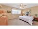 Calm bedroom with a ceiling fan and ample natural light, creating a cozy atmosphere at 2267 Pueblo Ln # V40, Sarasota, FL 34231