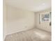 A bright bedroom featuring carpet and a window that provides natural light at 2267 Pueblo Ln # V40, Sarasota, FL 34231