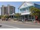 Street view of multi-story commercial buildings with colorful exteriors, showcasing a vibrant shopping district at 2267 Pueblo Ln # V40, Sarasota, FL 34231