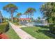 Relaxing community pool with well-maintained landscaping and surrounding greenery at 2267 Pueblo Ln # V40, Sarasota, FL 34231