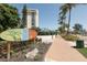 Siesta Key Village sign with tropical landscaping and a view of nearby condos at 2267 Pueblo Ln # V40, Sarasota, FL 34231