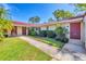 Charming home featuring a well-maintained lawn and vibrant landscaping at 2267 Pueblo Ln # V40, Sarasota, FL 34231