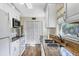 Updated kitchen with stainless appliances, granite counters, and ample cabinet space at 2267 Pueblo Ln # V40, Sarasota, FL 34231