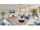 Comfortable living room layout, designed with modern furnishings, decor and fixtures at 2267 Pueblo Ln # V40, Sarasota, FL 34231