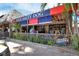 Outdoor dining area at Old Salty Dog restaurant featuring a thatched roof and colorful awnings at 2267 Pueblo Ln # V40, Sarasota, FL 34231