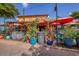 Outdoor seating at The Hub Bar & Grill with vibrant decor and lush plants at 2267 Pueblo Ln # V40, Sarasota, FL 34231