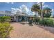 Outdoor shopping area featuring surf-themed shops and palm trees, perfect for leisurely strolls at 2267 Pueblo Ln # V40, Sarasota, FL 34231