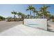Siesta Beach entrance sign with palm trees and manicured landscaping, a welcoming park setting at 2267 Pueblo Ln # V40, Sarasota, FL 34231