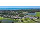 Aerial photo highlighting the community clubhouse, landscaping, and Gulf of Mexico waterfront at 228 Saint James Park, Osprey, FL 34229