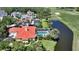 Aerial view of home with pool in a beautiful community on the water and golf course at 228 Saint James Park, Osprey, FL 34229