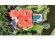 Aerial view of the home with an enclosed pool, red tile roof, and manicured lawn at 228 Saint James Park, Osprey, FL 34229