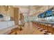 Modern bar area with ample seating, TVs, and views of the tropical landscape at 228 Saint James Park, Osprey, FL 34229