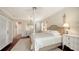 Inviting bedroom features a four poster bed, a bay window with shutters, and traditional furnishings at 228 Saint James Park, Osprey, FL 34229
