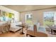Cozy dining area with booth seating, natural light, and a view of the lush exterior at 228 Saint James Park, Osprey, FL 34229