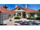Charming home with lovely windows, shutters, and well-manicured landscaping at 228 Saint James Park, Osprey, FL 34229