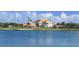 Daytime exterior view of a building overlooking the lake, highlighting its architecture at 228 Saint James Park, Osprey, FL 34229