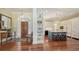 Welcoming foyer with hardwood floors, leading to the kitchen with a center island at 228 Saint James Park, Osprey, FL 34229