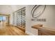 Hallway with hardwood floors, wine storage and a decorative wall sign at 228 Saint James Park, Osprey, FL 34229