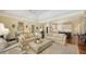 Spacious living area with view to the kitchen, offering an open-concept design at 228 Saint James Park, Osprey, FL 34229