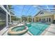 Enjoy the outdoors in this screened pool, including a hot tub and a patio with plenty of room for outdoor seating at 228 Saint James Park, Osprey, FL 34229