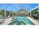 Enjoy the outdoors in this screened pool, including a hot tub and a patio with plenty of room for outdoor seating at 228 Saint James Park, Osprey, FL 34229