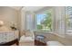 Bright sitting area features a large bay window with shutters, a comfortable chair, and natural light at 228 Saint James Park, Osprey, FL 34229