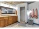 Updated bathroom boasts granite counters, double sinks, updated tile floor, and a spacious walk-in shower at 23088 Allen Ave, Port Charlotte, FL 33980