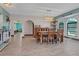 Bright dining room with stylish furnishings and a view of the water at 23088 Allen Ave, Port Charlotte, FL 33980