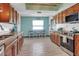 Well-lit kitchen featuring ample cabinetry and modern stainless steel appliances at 23088 Allen Ave, Port Charlotte, FL 33980