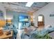 Cozy living room with a skylight, comfortable furnishings, and coastal decor at 23088 Allen Ave, Port Charlotte, FL 33980