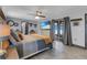 Bright primary bedroom with modern finishes features tile floor, sliding glass doors to the patio, and a ceiling fan at 23088 Allen Ave, Port Charlotte, FL 33980