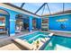 Beautiful pool and spa area featuring a covered lanai and poolside seating, ideal for enjoying warm weather at 23088 Allen Ave, Port Charlotte, FL 33980