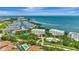 Stunning view of waterfront condos, marina, tennis courts, pool and lush landscaping, near beautiful ocean at 2450 Harbourside Dr # 233, Longboat Key, FL 34228
