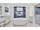 Elegant bathroom with soaking tub, stylish tile accents, and sleek vanity area at 2450 Harbourside Dr # 233, Longboat Key, FL 34228