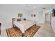 Bedroom with light floors, ceiling fan, and decorative rug at 2450 Harbourside Dr # 233, Longboat Key, FL 34228