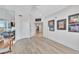 Bonus room with mirrored wall, hardwood floors, and light walls at 2450 Harbourside Dr # 233, Longboat Key, FL 34228