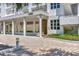 Exterior building entrance featuring a drive-through and lush landscaping at 2450 Harbourside Dr # 233, Longboat Key, FL 34228